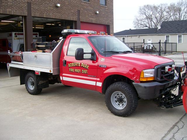 Brush 31. Outfitted with plow for winter.